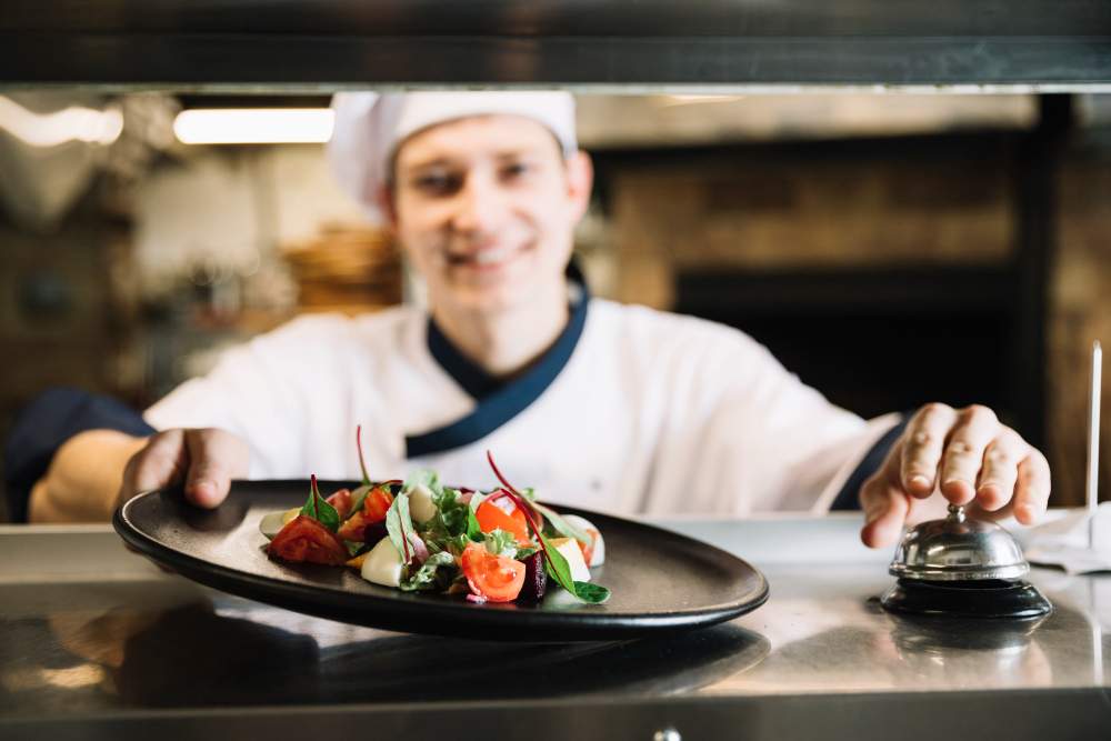 cook-with-salad-ringing-service-bell